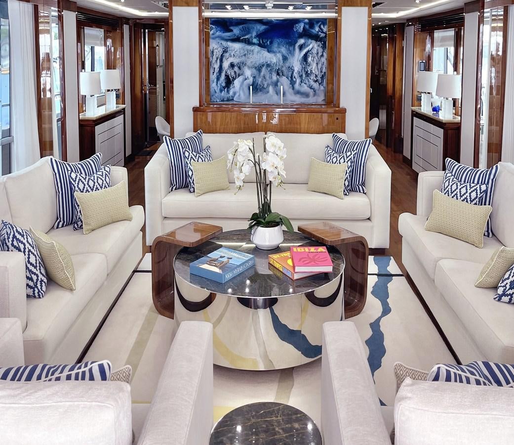 a living room with a white couch and a coffee table aboard ANYA Yacht for Sale
