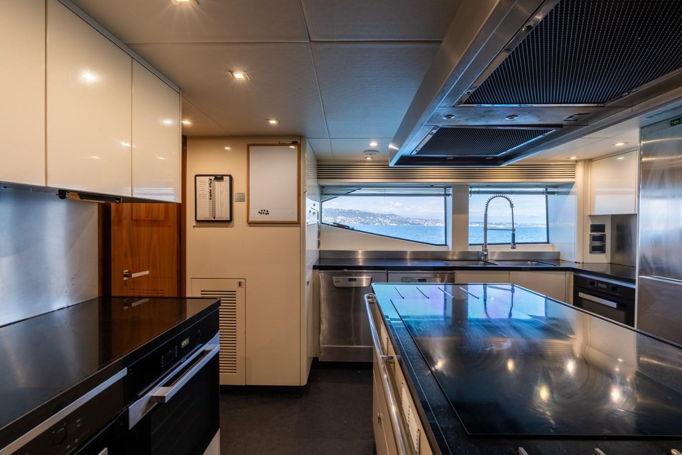 a kitchen with a large island aboard ANYA Yacht for Sale