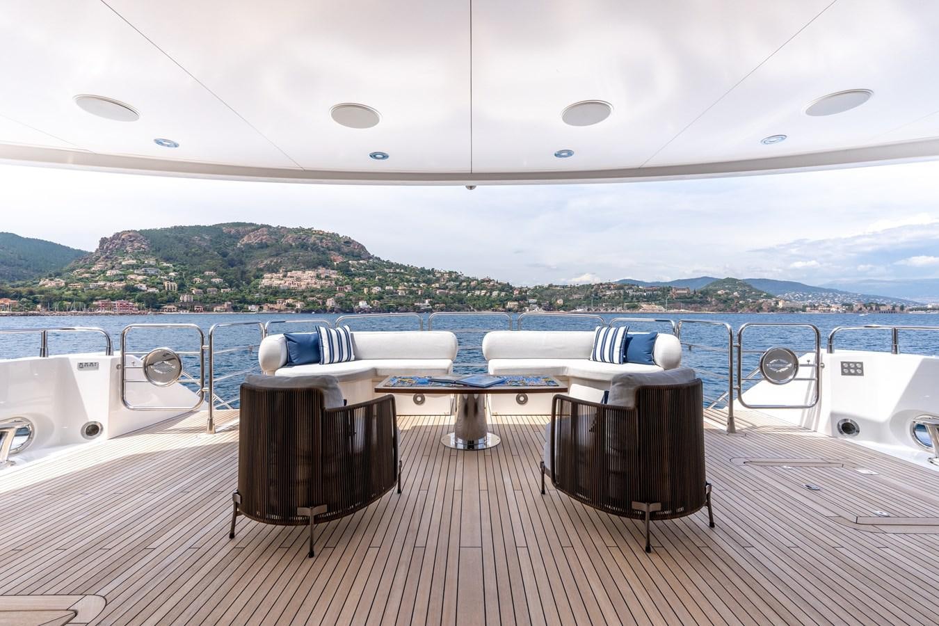 a deck with a table and chairs on it aboard ANYA Yacht for Sale