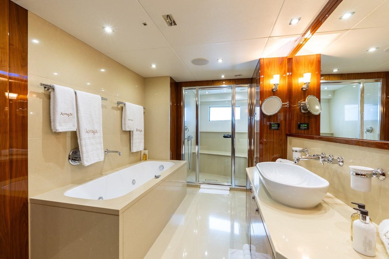 a bathroom with a large mirror aboard ANYA Yacht for Sale