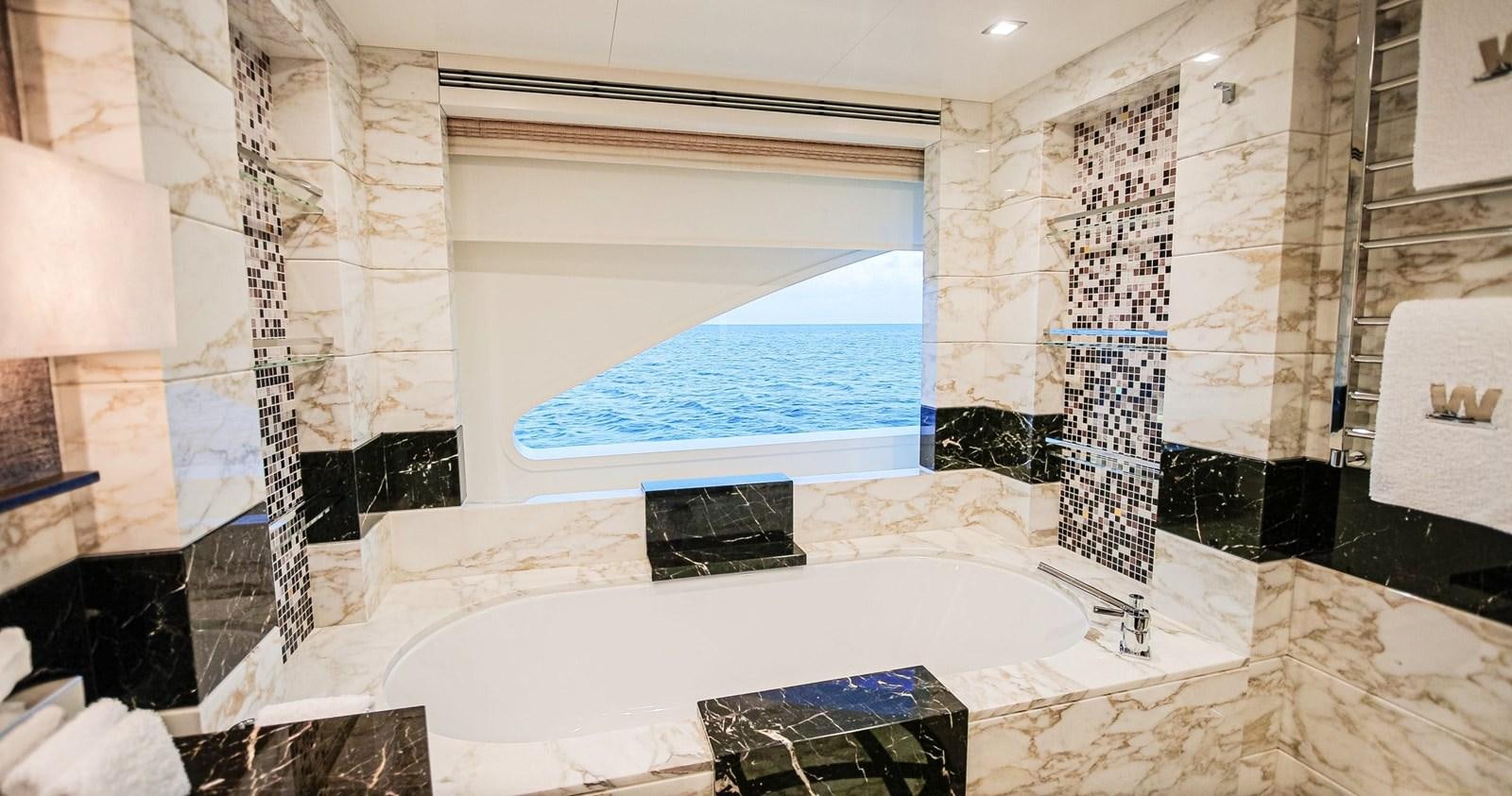 a large jacuzzi in a bathroom aboard W Yacht for Sale