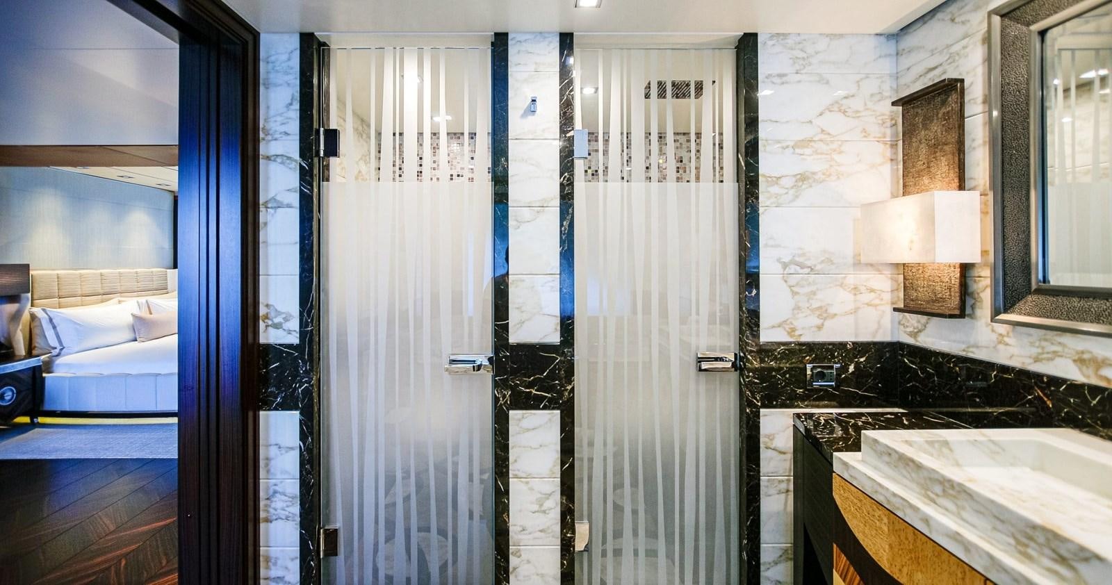 a bathroom with a tub and shower aboard W Yacht for Sale