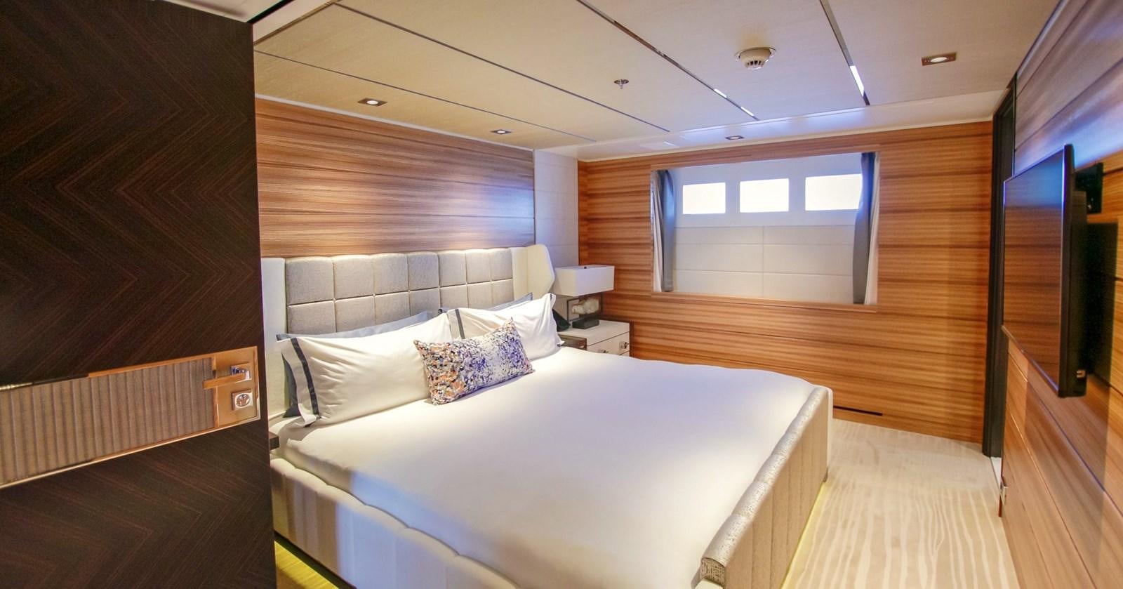 a room with a bed and a window aboard W Yacht for Sale