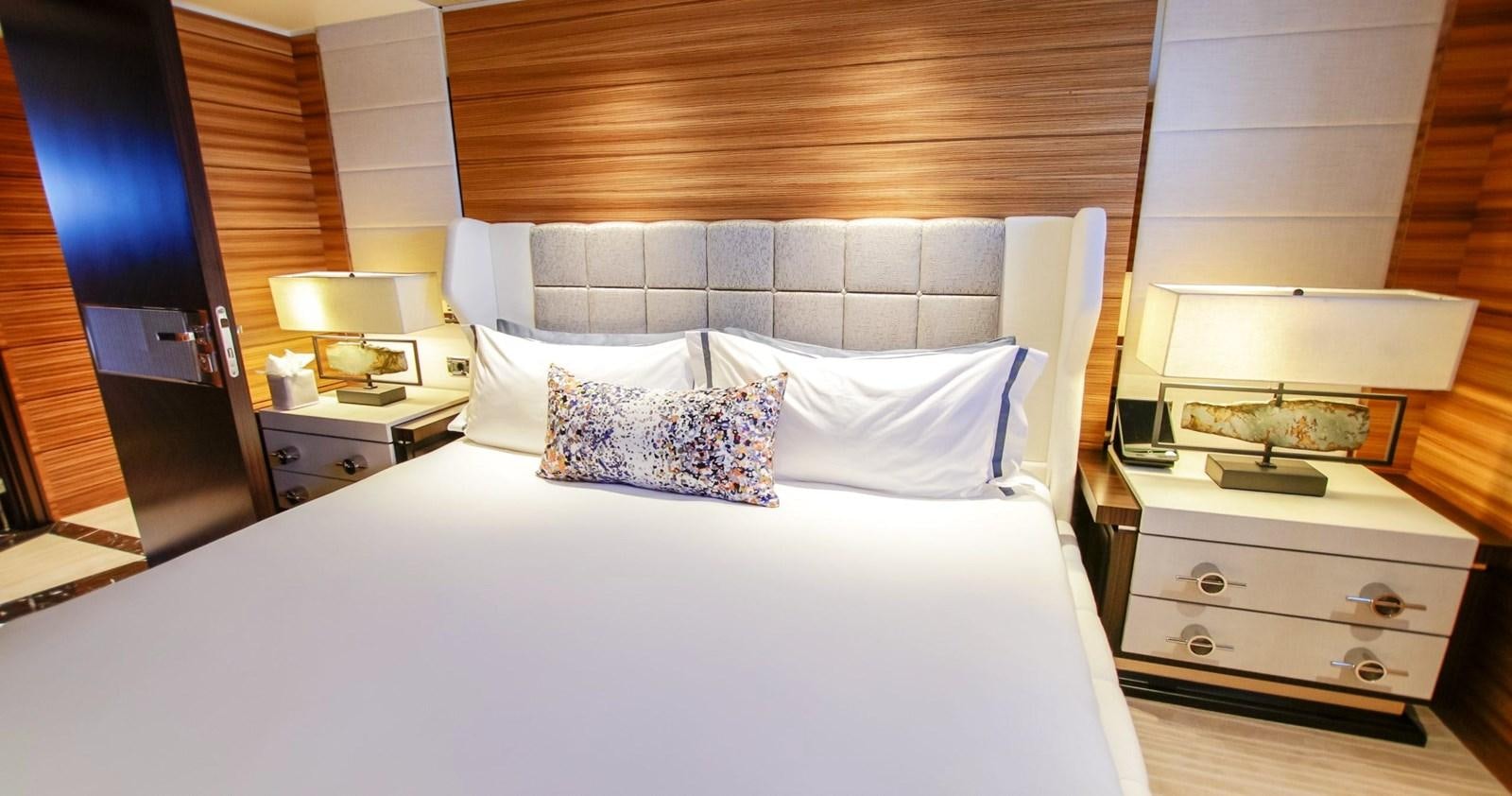 a bed with white sheets and pillows aboard W Yacht for Sale