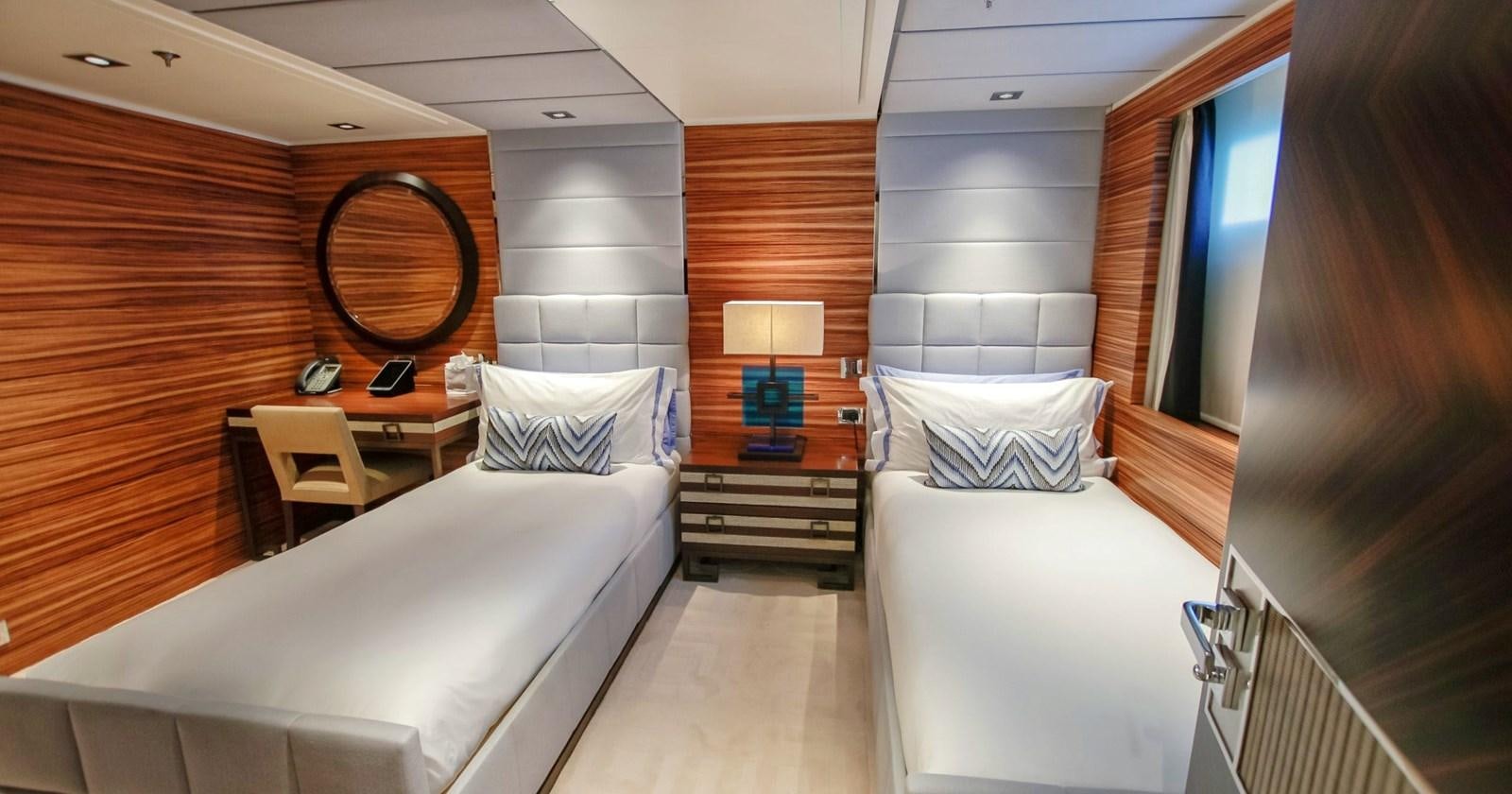 a room with two beds aboard W Yacht for Sale