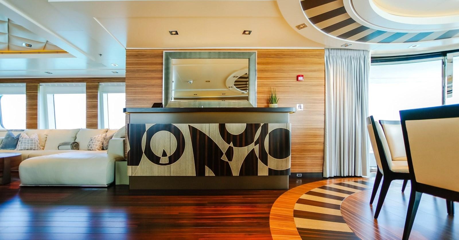 a living room with a couch and a table aboard W Yacht for Sale