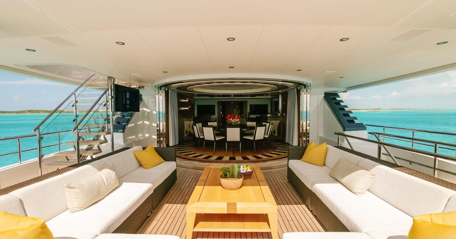 a room with a balcony and a view of the ocean aboard W Yacht for Sale