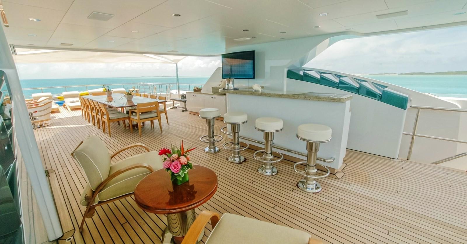 a room with tables and chairs aboard W Yacht for Sale