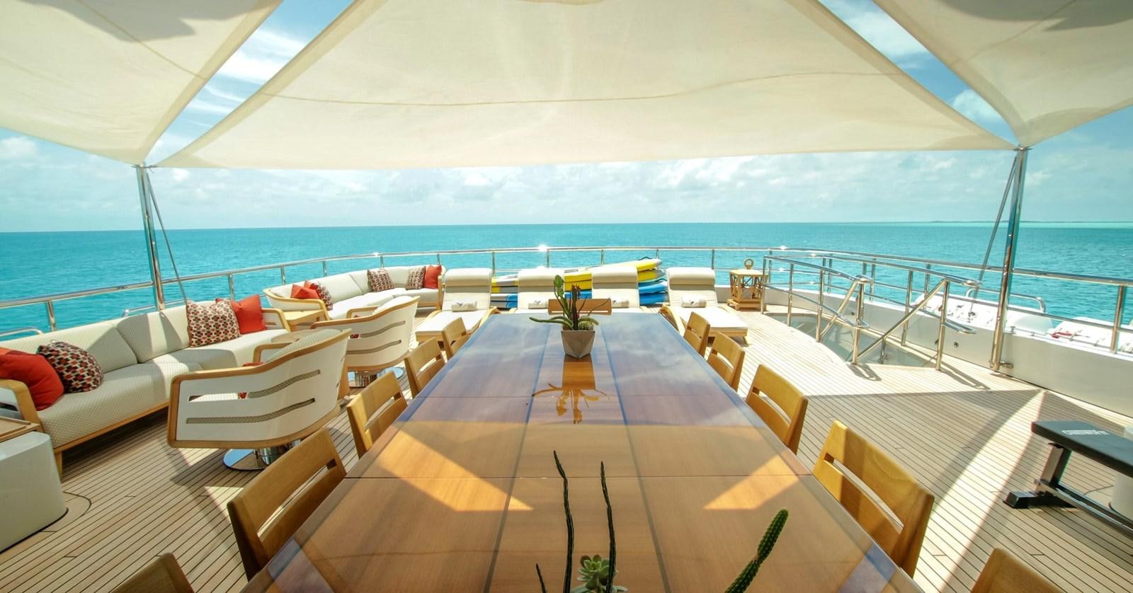 a large lounge area with a large deck overlooking the ocean aboard W Yacht for Sale