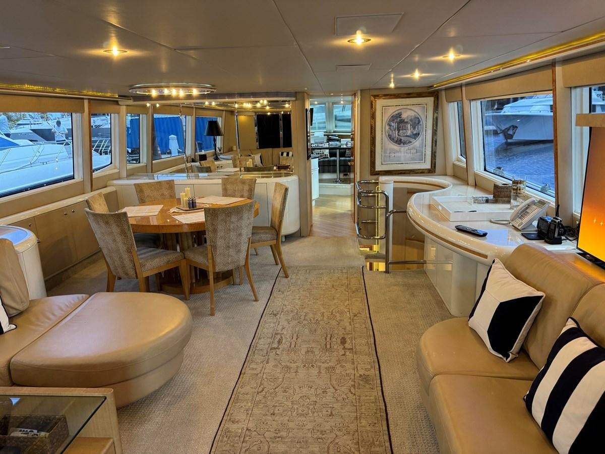 a living room with a large window aboard DARE TO DREAM Yacht for Sale