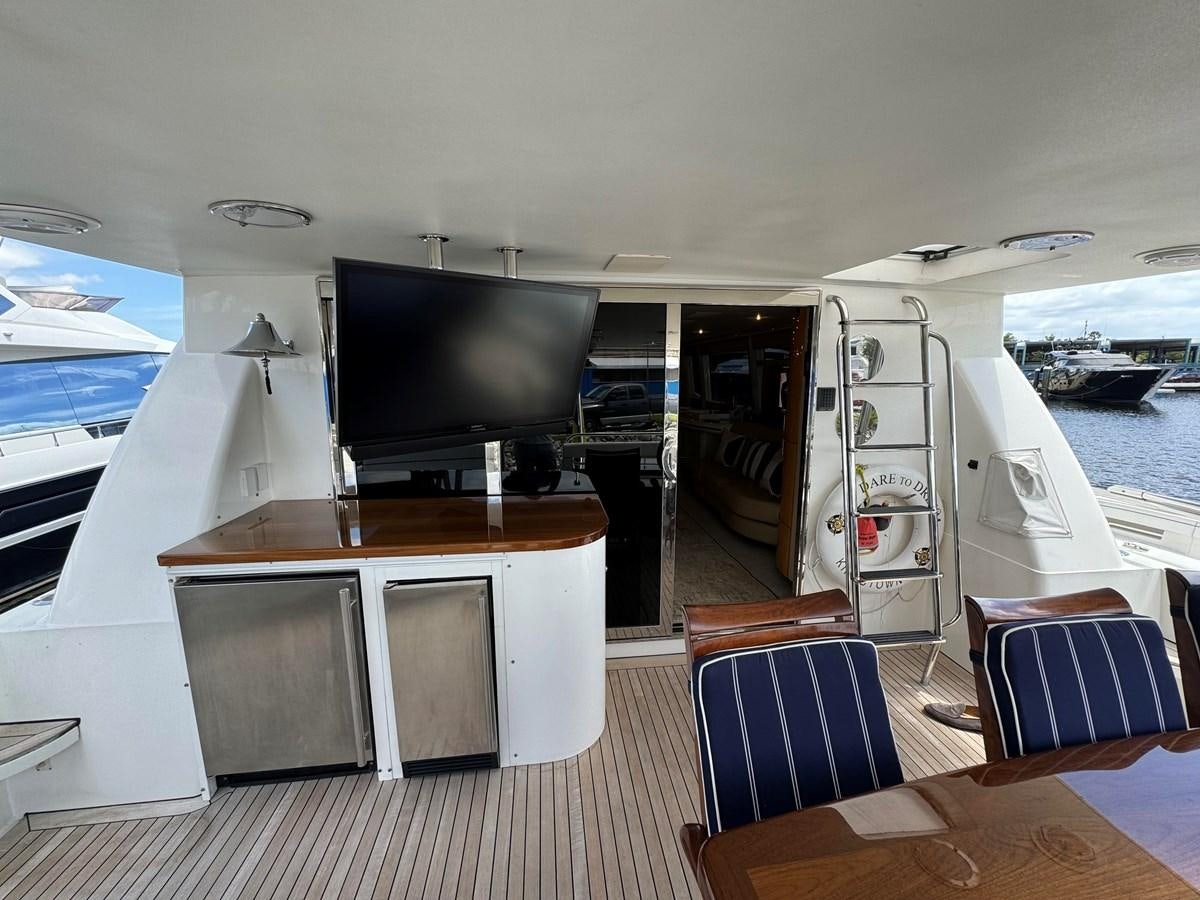 a boat with a tv on the deck aboard DARE TO DREAM Yacht for Sale