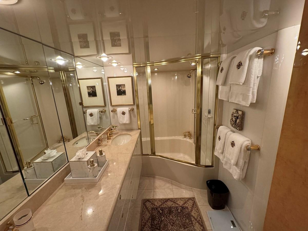 a bathroom with a glass shower aboard DARE TO DREAM Yacht for Sale