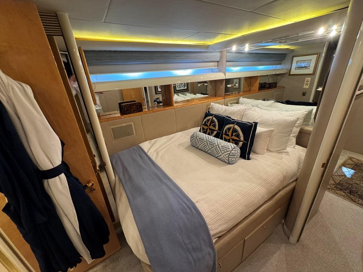 a room with a bed and a window aboard DARE TO DREAM Yacht for Sale