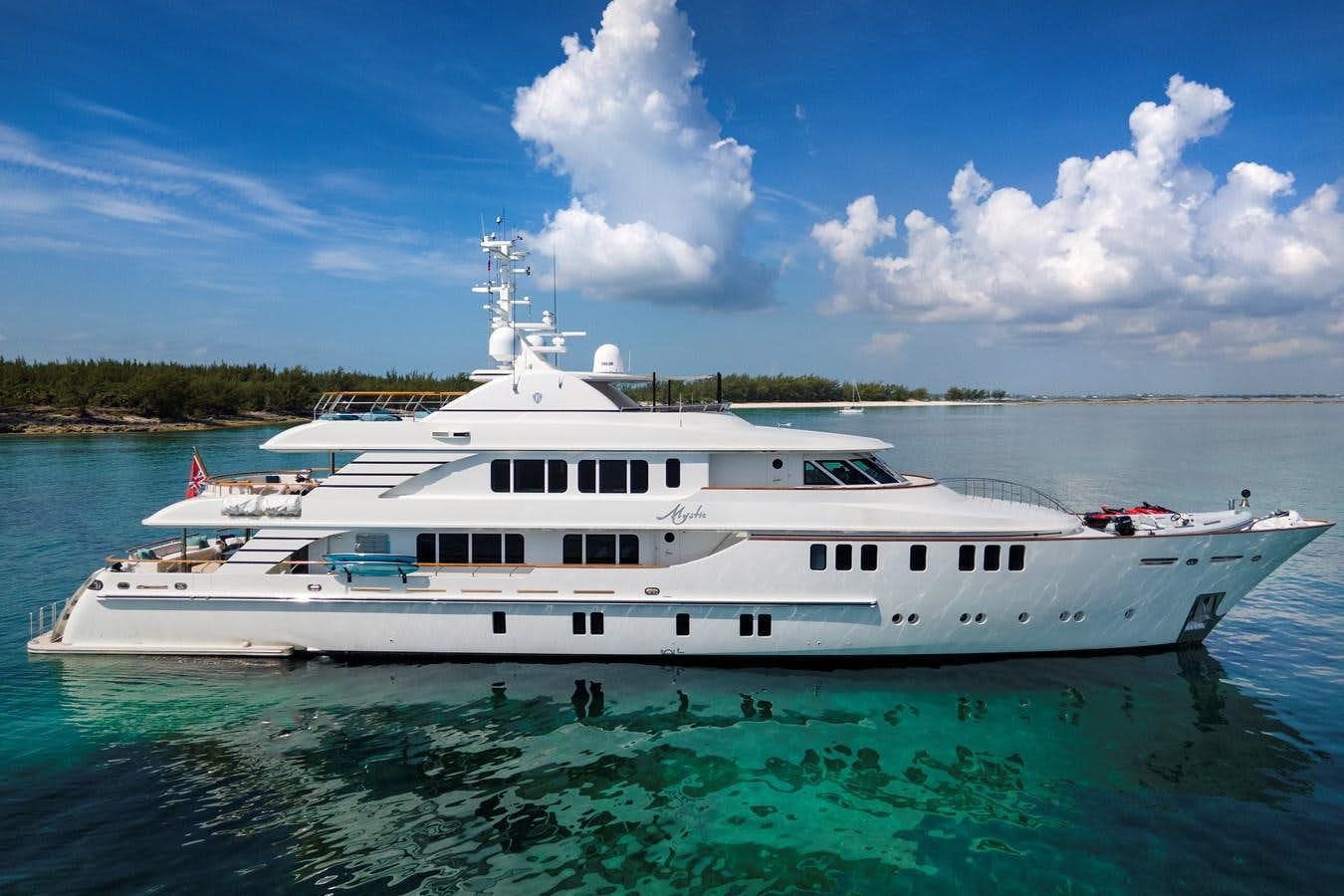 a large white boat in the water aboard MYSTIC Yacht for Sale