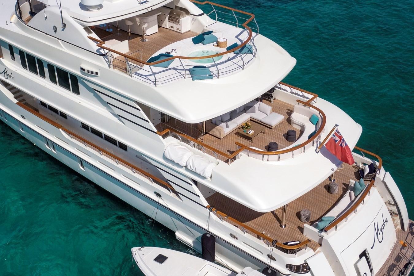 a large white boat on the water aboard MYSTIC Yacht for Sale
