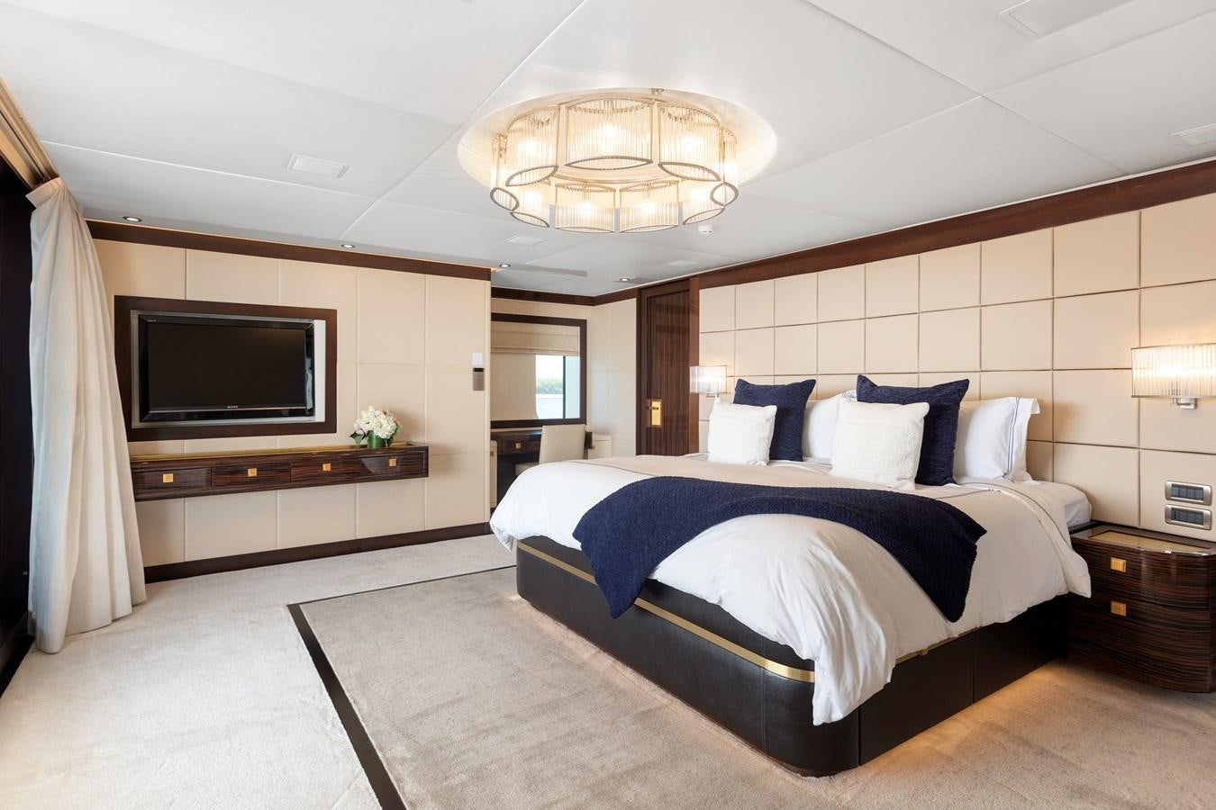 a large bedroom with a large bed aboard MYSTIC Yacht for Sale