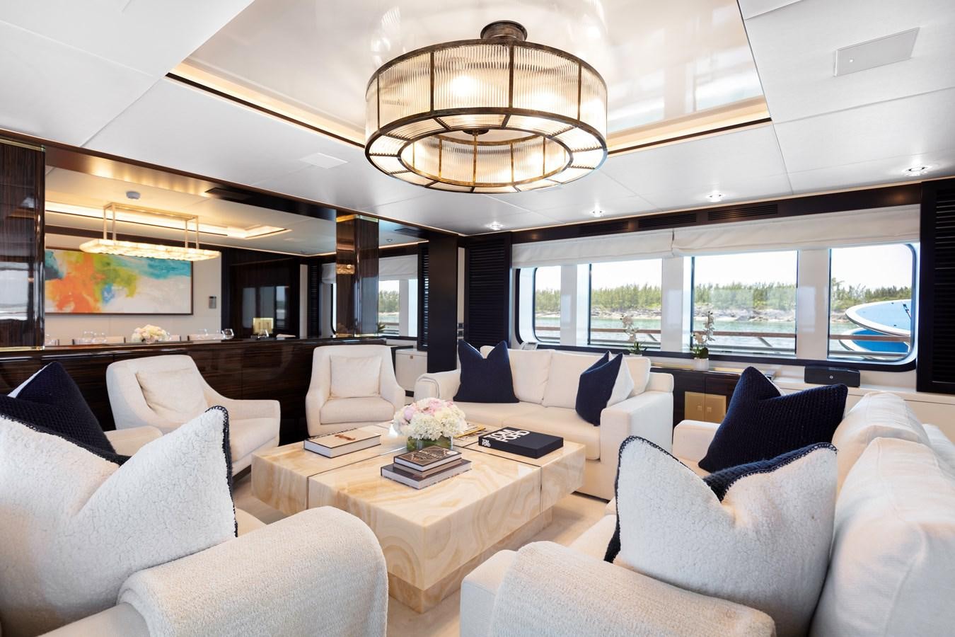 a room with couches and a table aboard MYSTIC Yacht for Sale