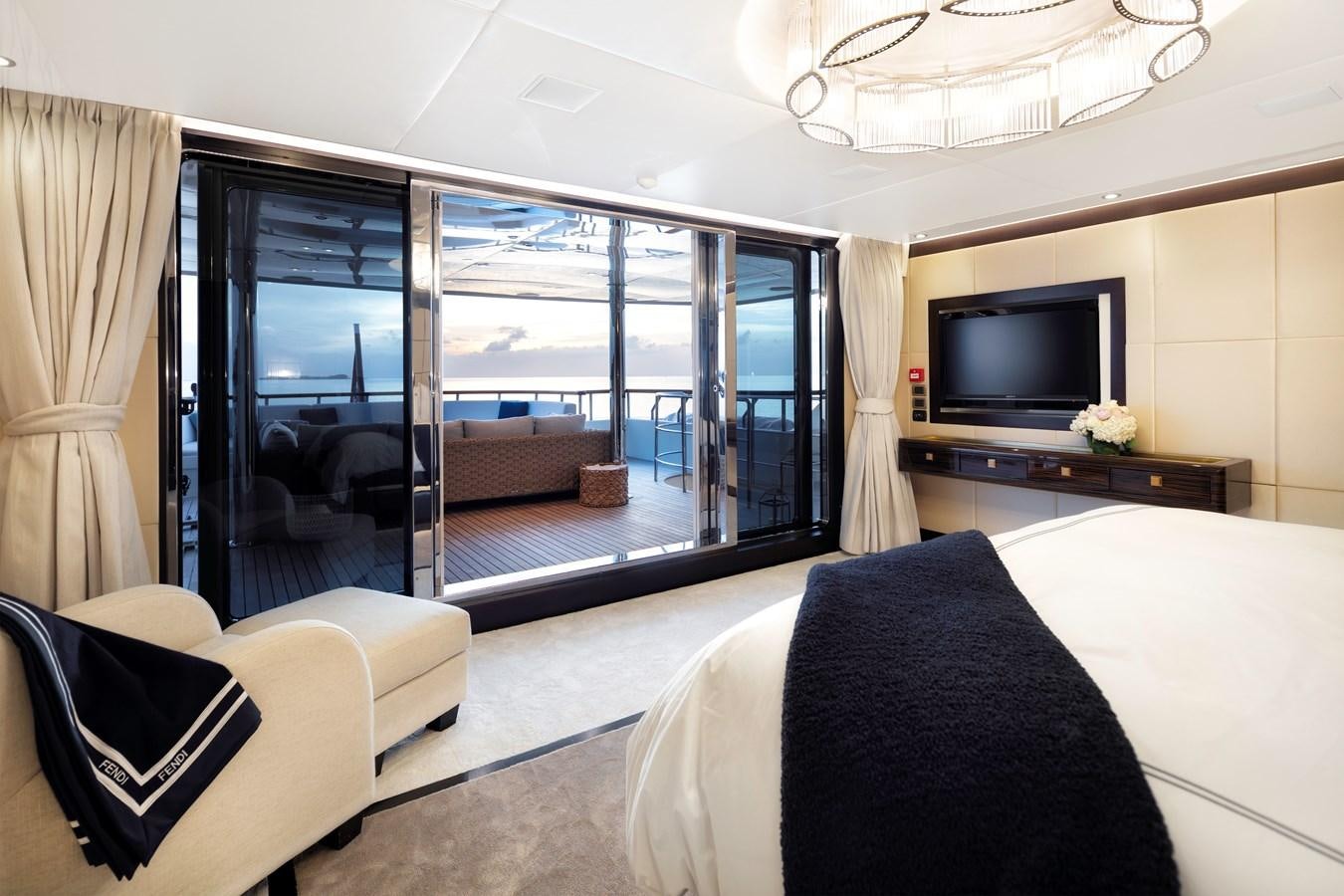a bedroom with a large glass door aboard MYSTIC Yacht for Sale