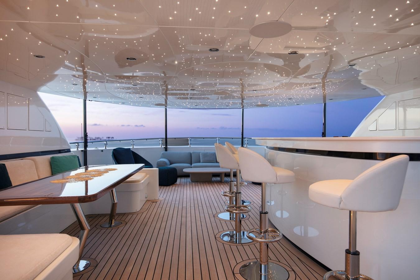 a room with tables and chairs aboard MYSTIC Yacht for Sale