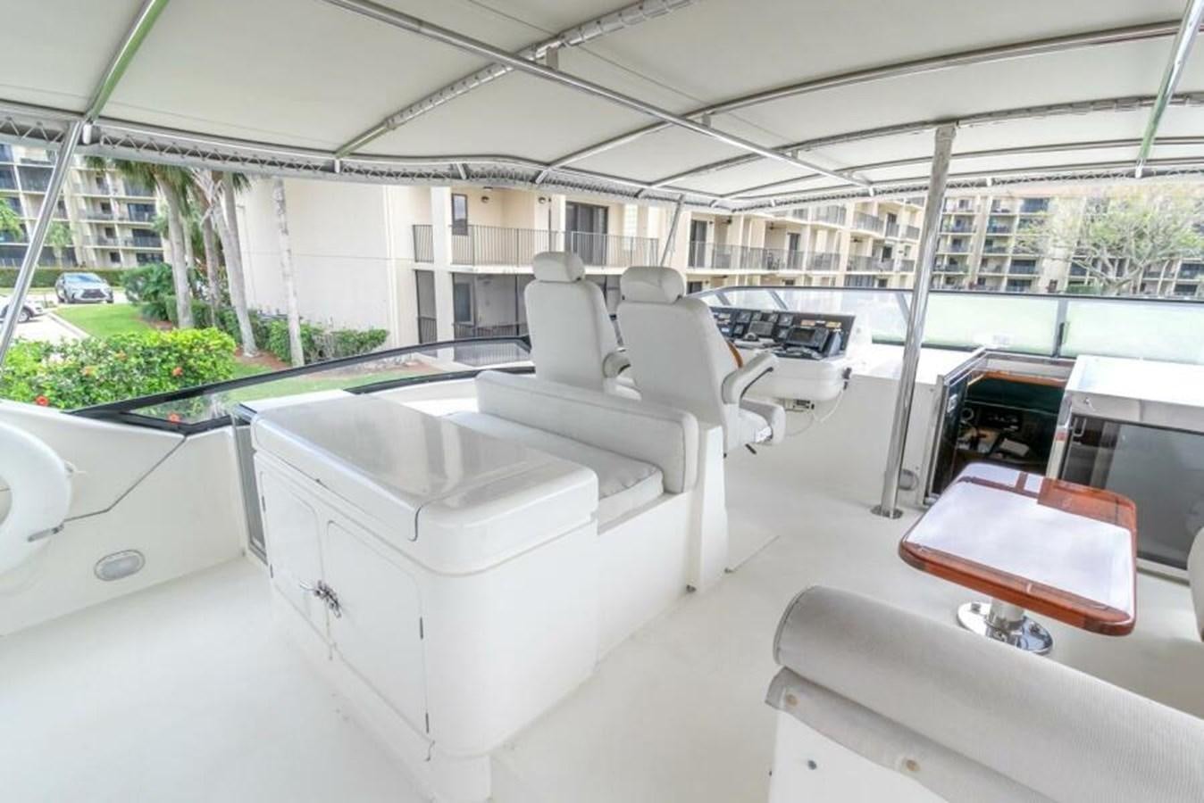 a room with a couch and a table aboard SAND DOLLAR Yacht for Sale