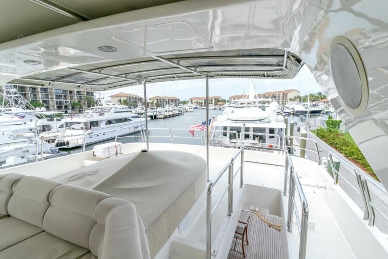 a large white boat in a harbor aboard SAND DOLLAR Yacht for Sale