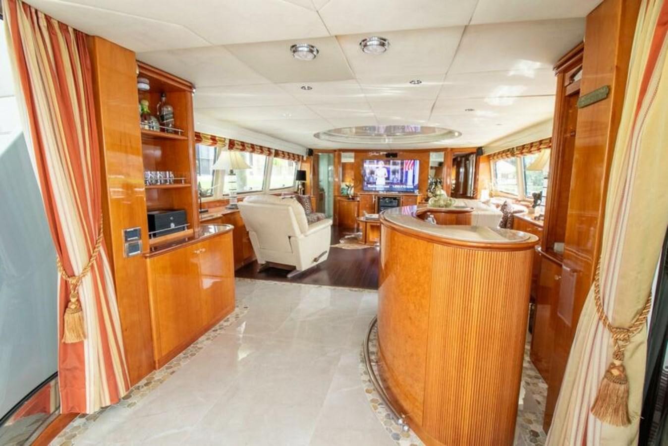 a living room with a kitchen and a dining room aboard SAND DOLLAR Yacht for Sale