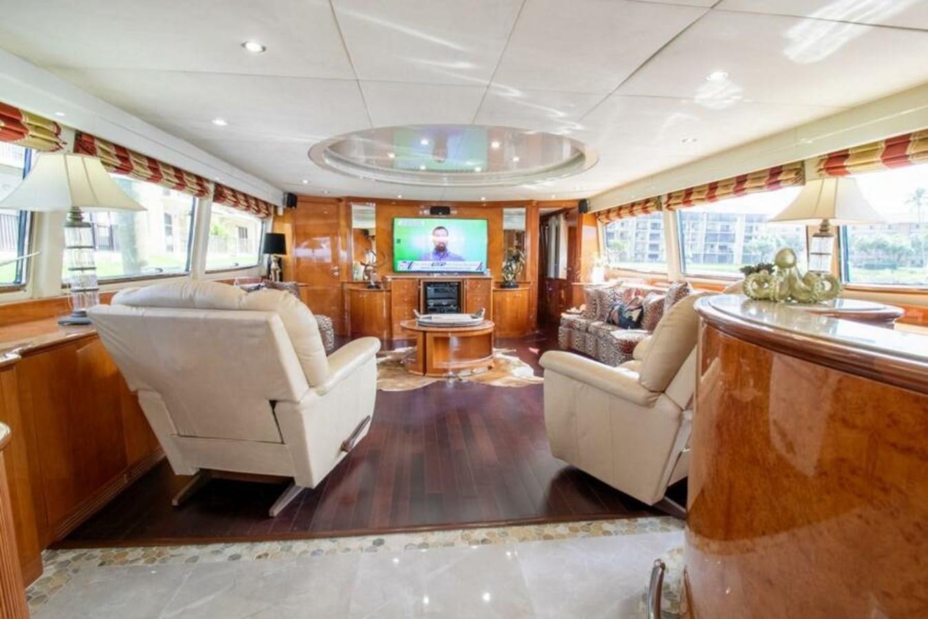 a living room with a large mirror aboard SAND DOLLAR Yacht for Sale