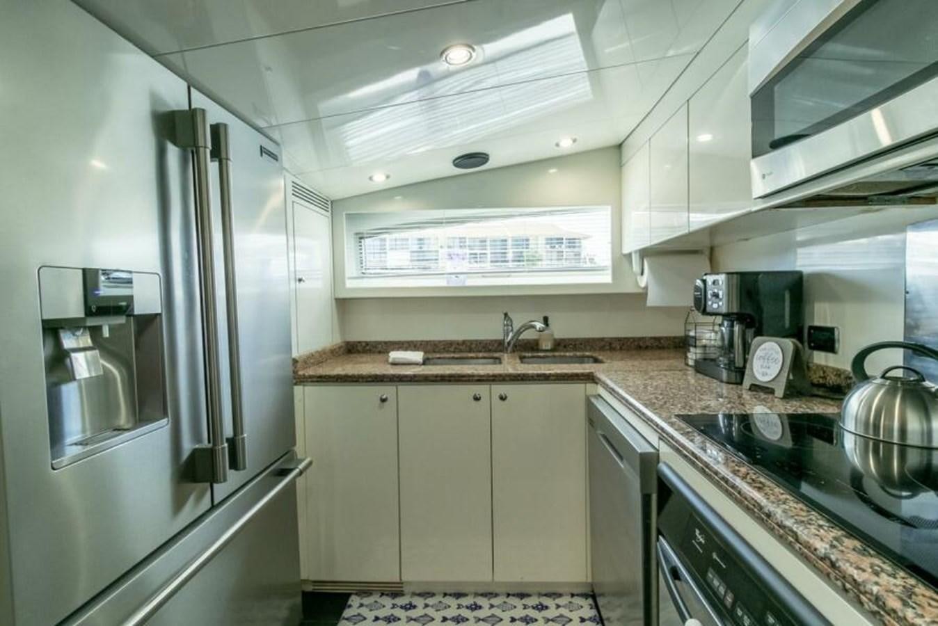a kitchen with stainless steel appliances aboard SAND DOLLAR Yacht for Sale