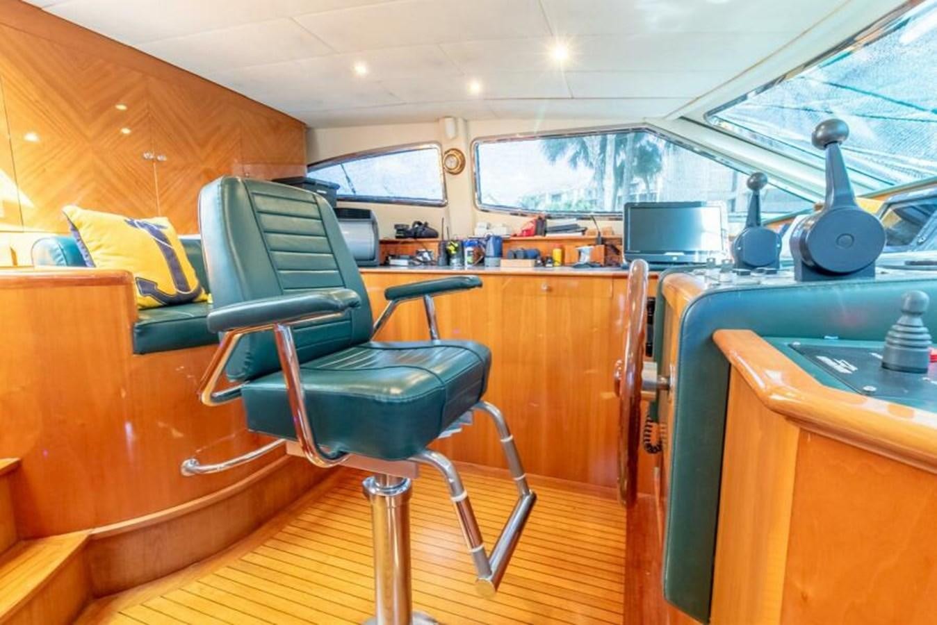 a room with a table and chairs aboard SAND DOLLAR Yacht for Sale