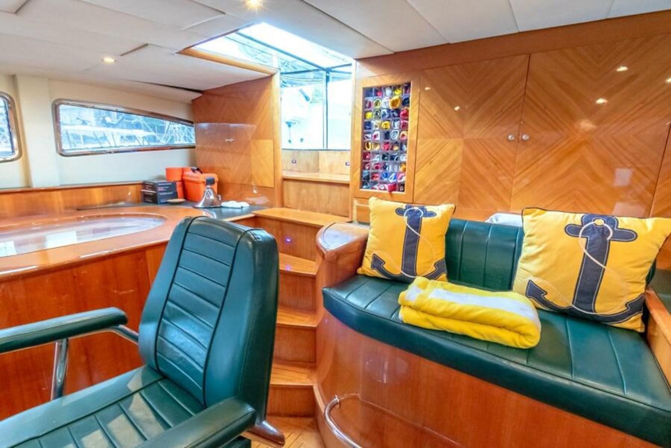 a kitchen with a couch and a table aboard SAND DOLLAR Yacht for Sale