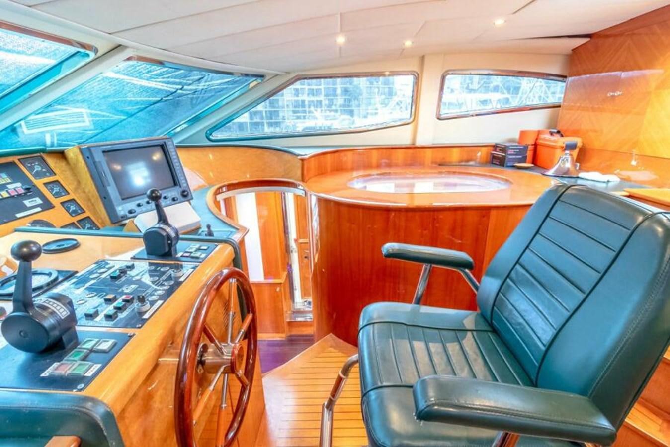 a room with a table and chairs aboard SAND DOLLAR Yacht for Sale