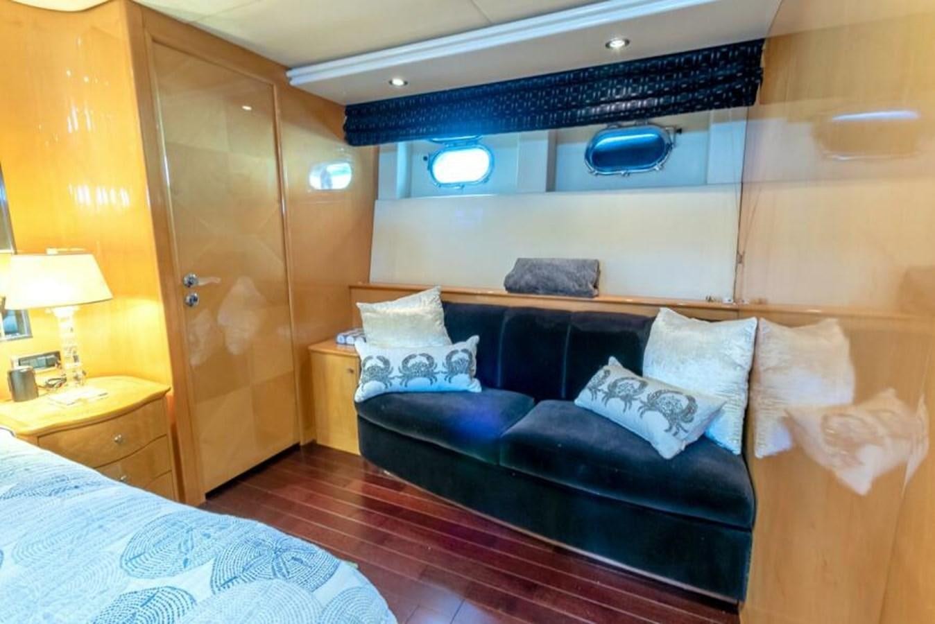 a room with a bed and a desk aboard SAND DOLLAR Yacht for Sale