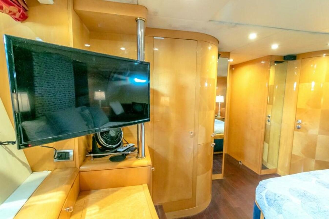 a tv on a stand in a room aboard SAND DOLLAR Yacht for Sale