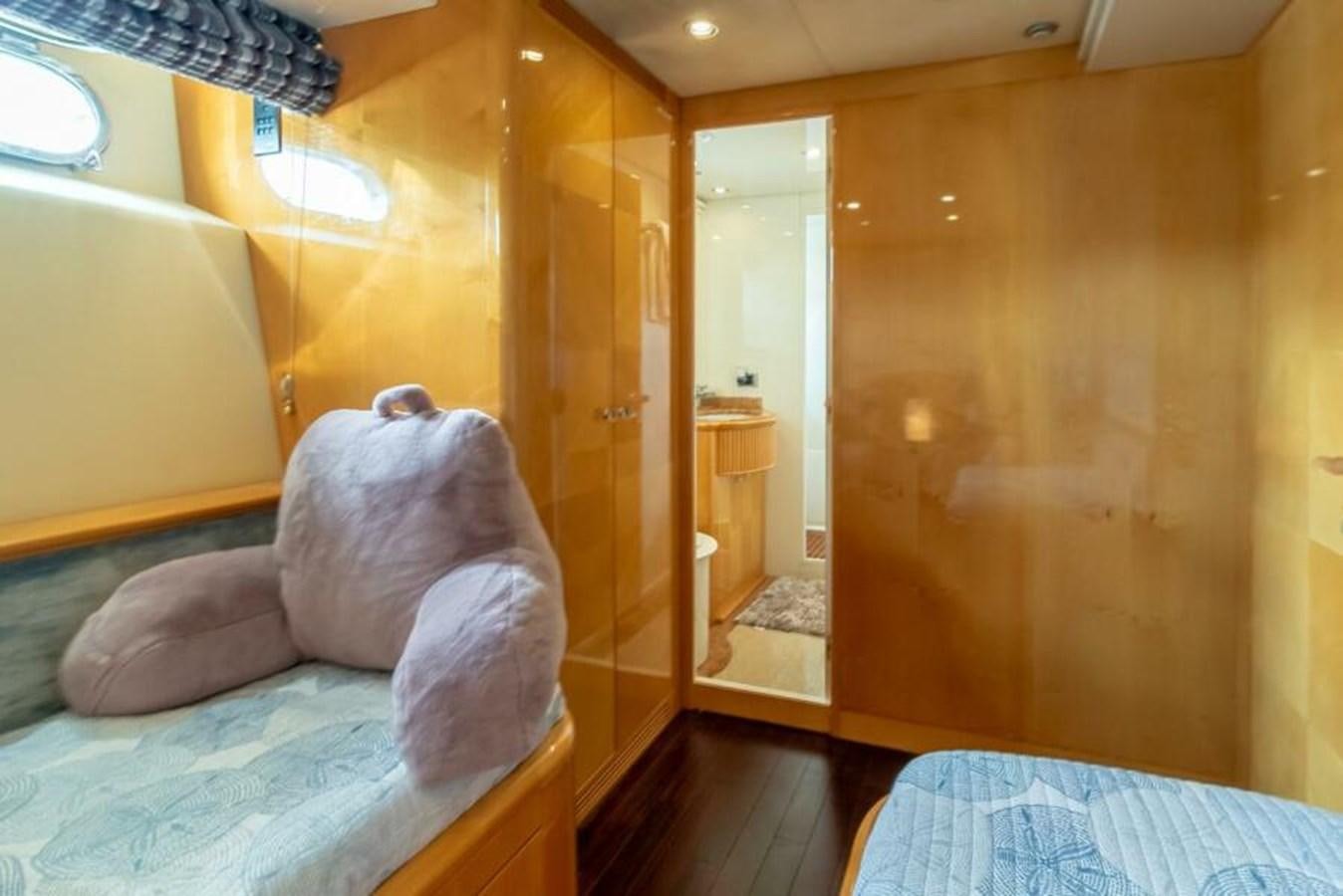 a room with a bed and a closet aboard SAND DOLLAR Yacht for Sale