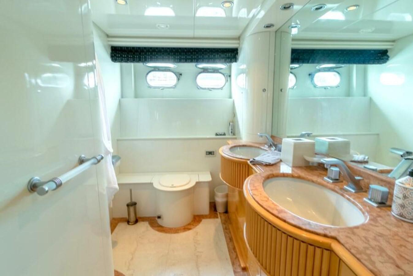 a bathroom with a sink and a mirror aboard SAND DOLLAR Yacht for Sale
