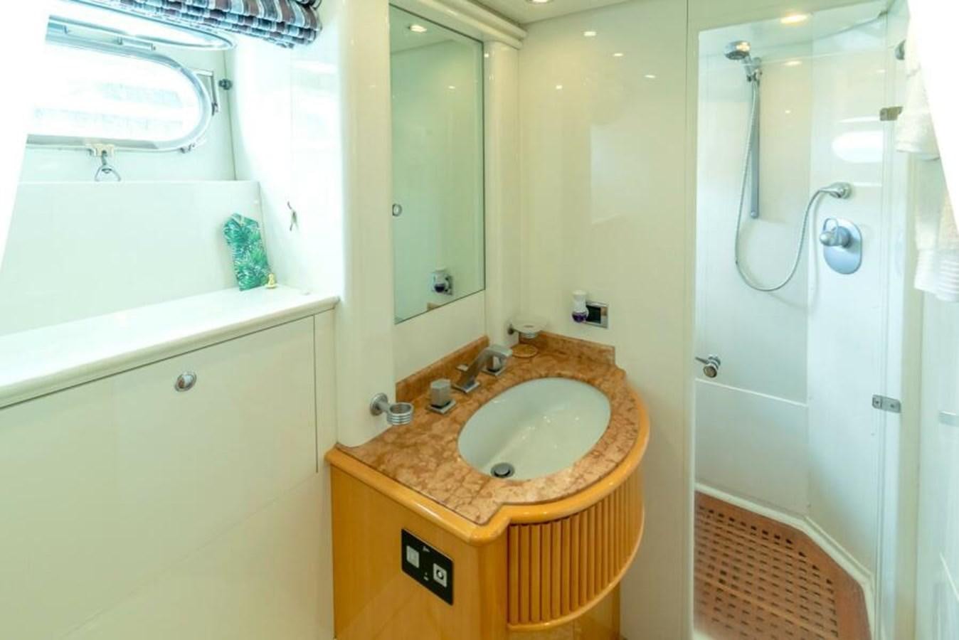 a bathroom with a sink and a tub aboard SAND DOLLAR Yacht for Sale