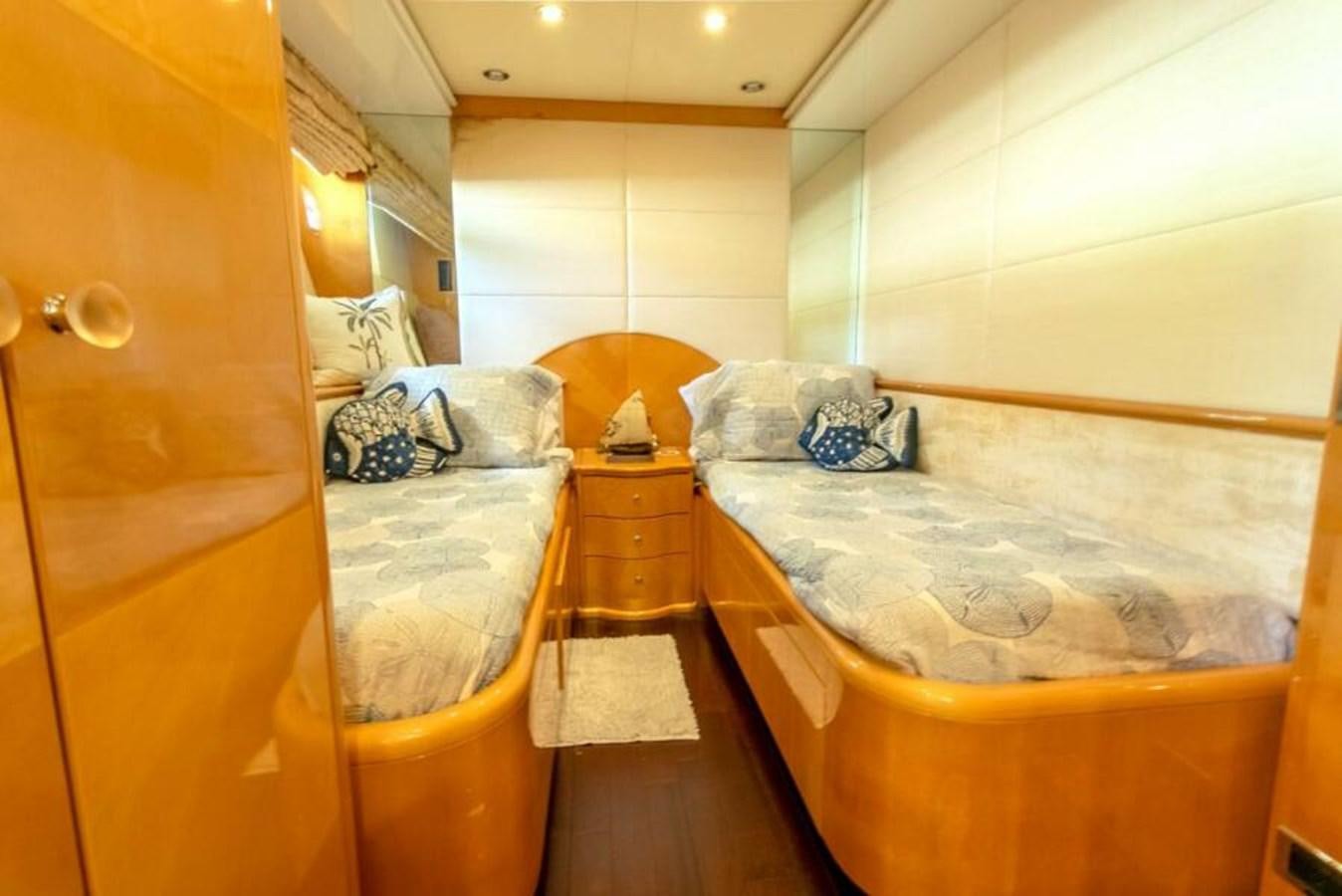 a room with a bed and a dresser aboard SAND DOLLAR Yacht for Sale