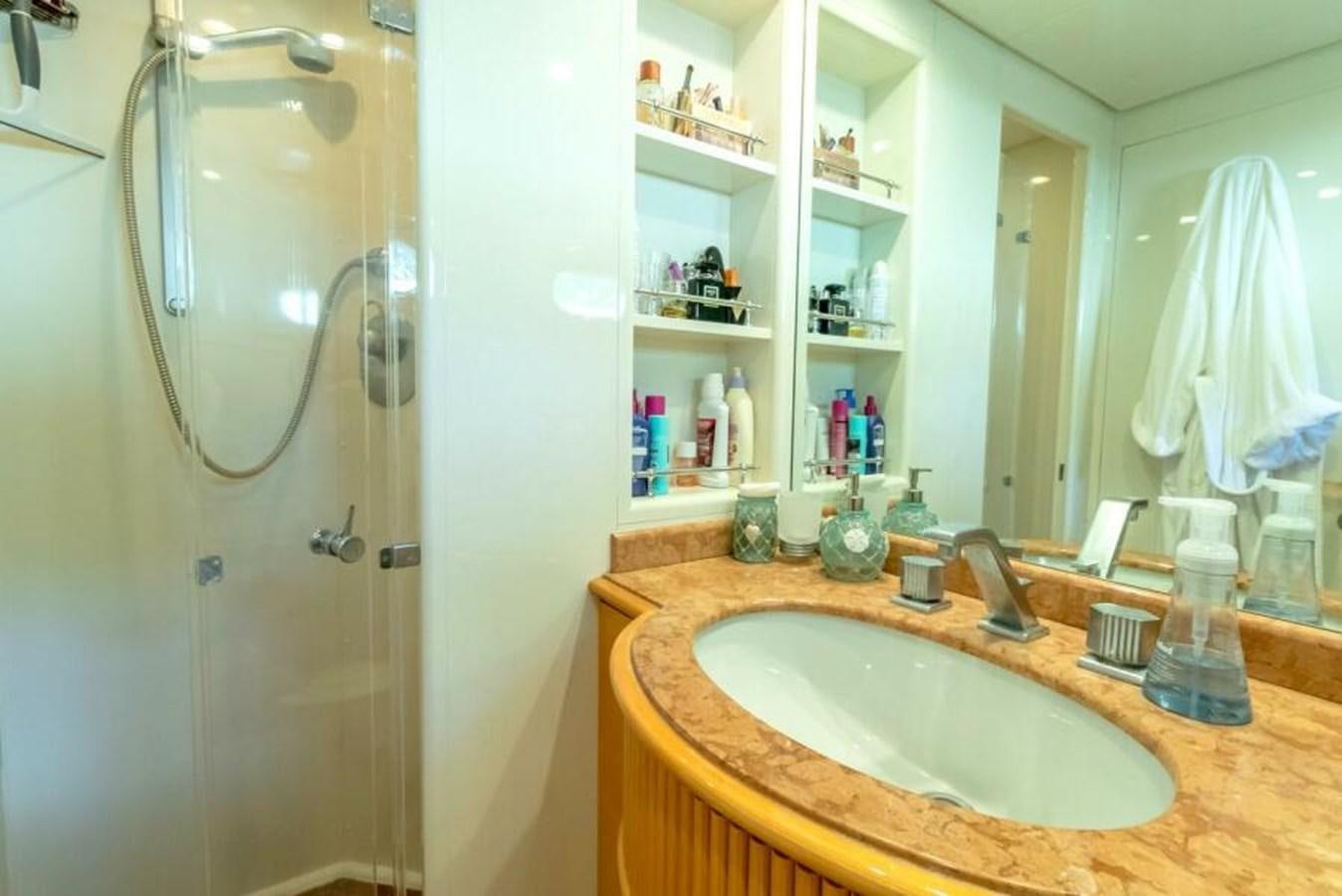 a bathroom with a sink and a shower aboard SAND DOLLAR Yacht for Sale