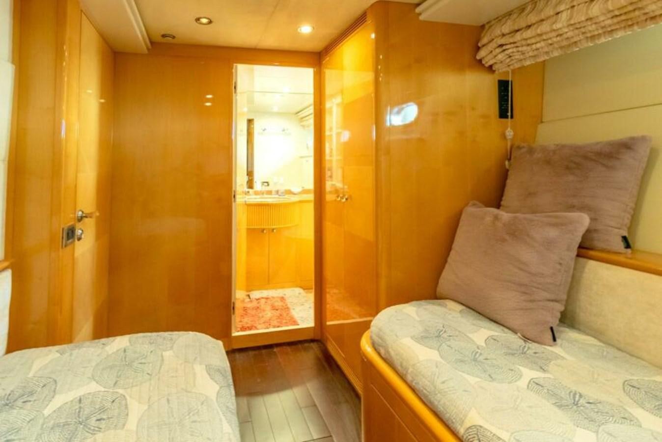 a bed in a room aboard SAND DOLLAR Yacht for Sale
