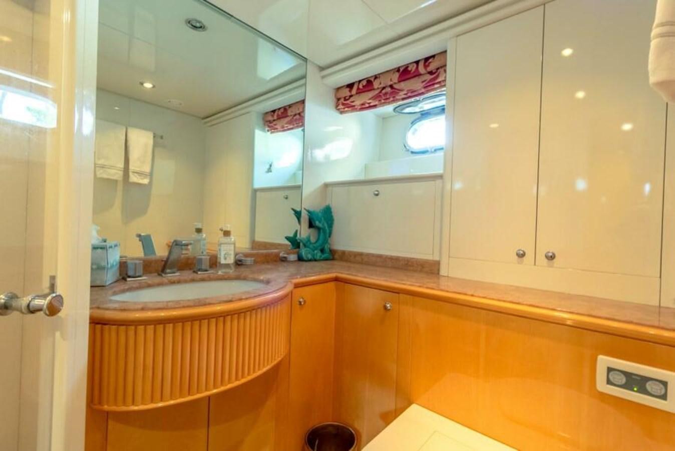 a bathroom with a large mirror aboard SAND DOLLAR Yacht for Sale