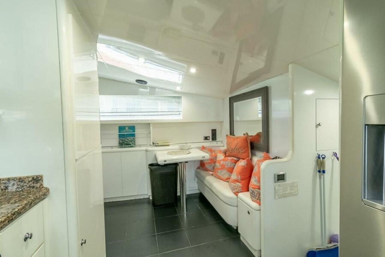 a room with a bed and a desk aboard SAND DOLLAR Yacht for Sale