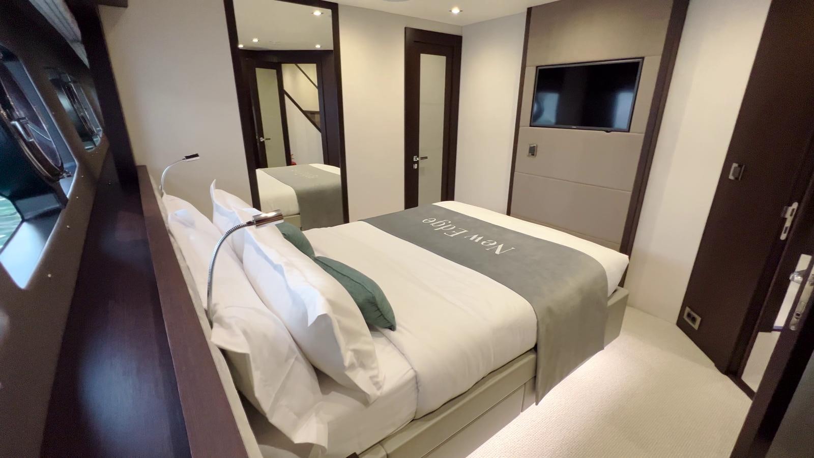 a hotel room with a bed aboard NEW EDGE Yacht for Sale