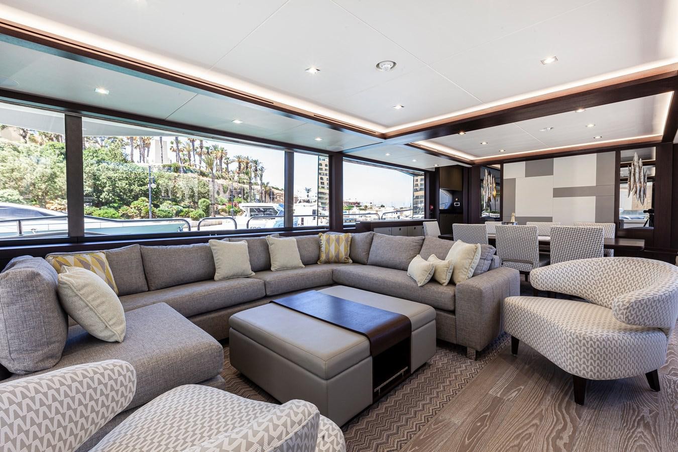 a living room with a large window aboard NEW EDGE Yacht for Sale