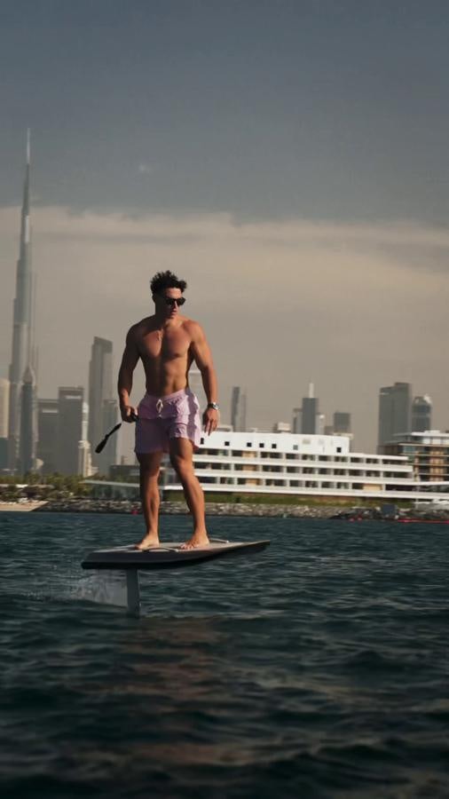 a man on a paddle board aboard NEW EDGE Yacht for Sale