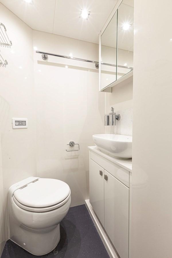 a bathroom with a sink and toilet aboard NEW EDGE Yacht for Sale