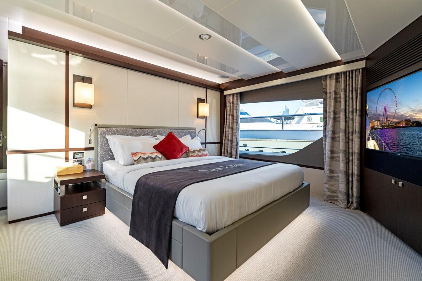 a hotel room with a large bed aboard NEW EDGE Yacht for Sale
