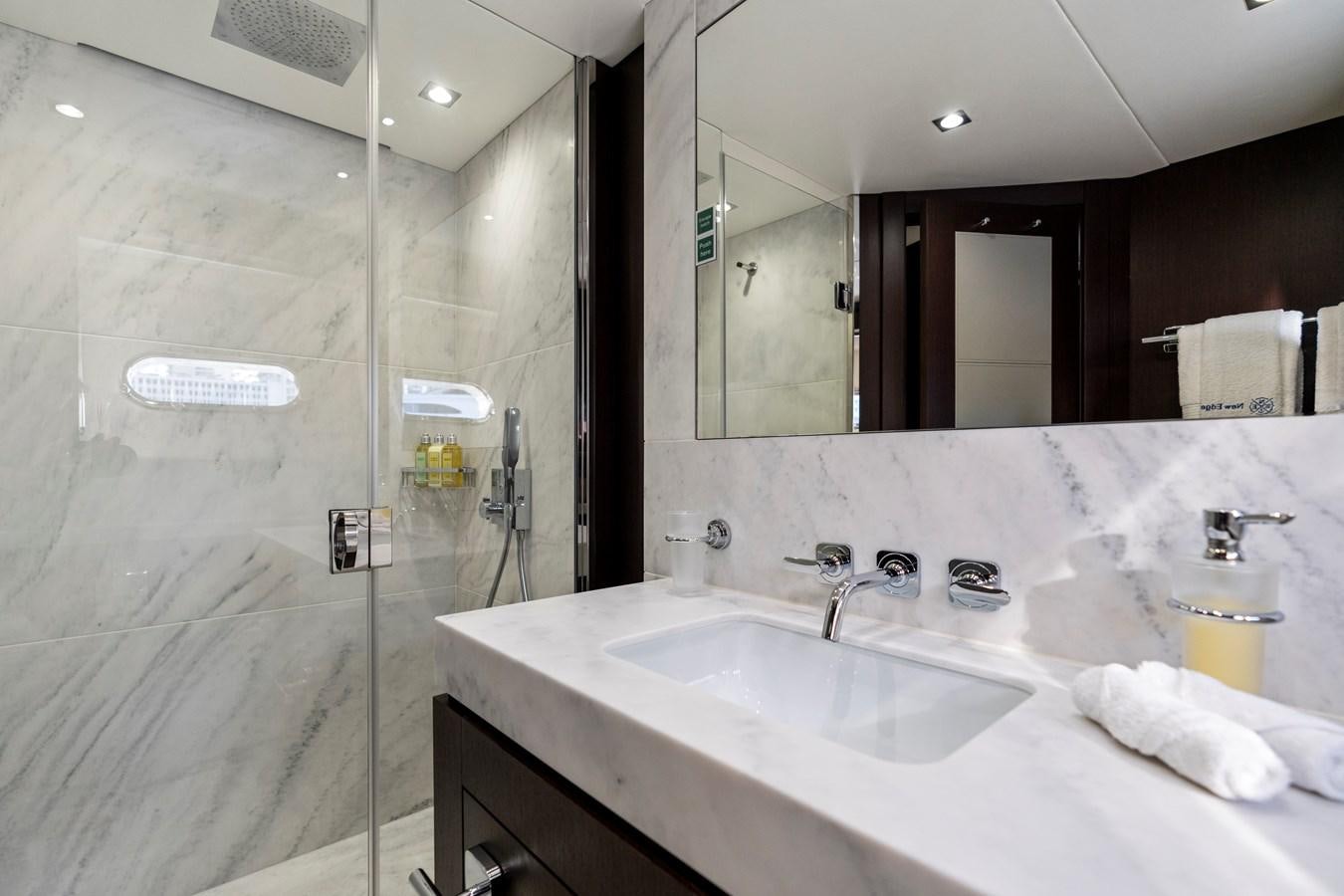 a bathroom with a large mirror aboard NEW EDGE Yacht for Sale