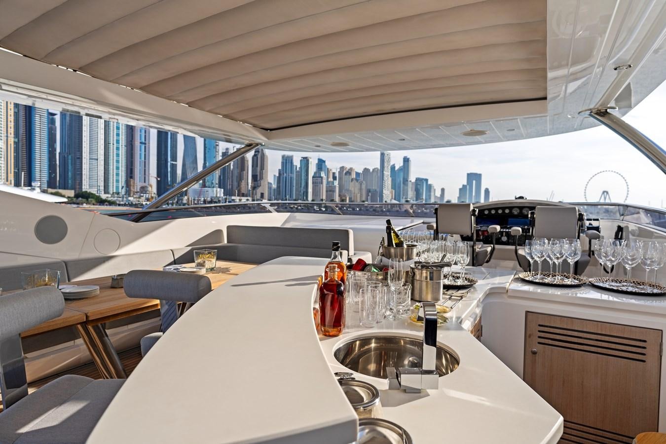 a room with a table and chairs aboard NEW EDGE Yacht for Sale