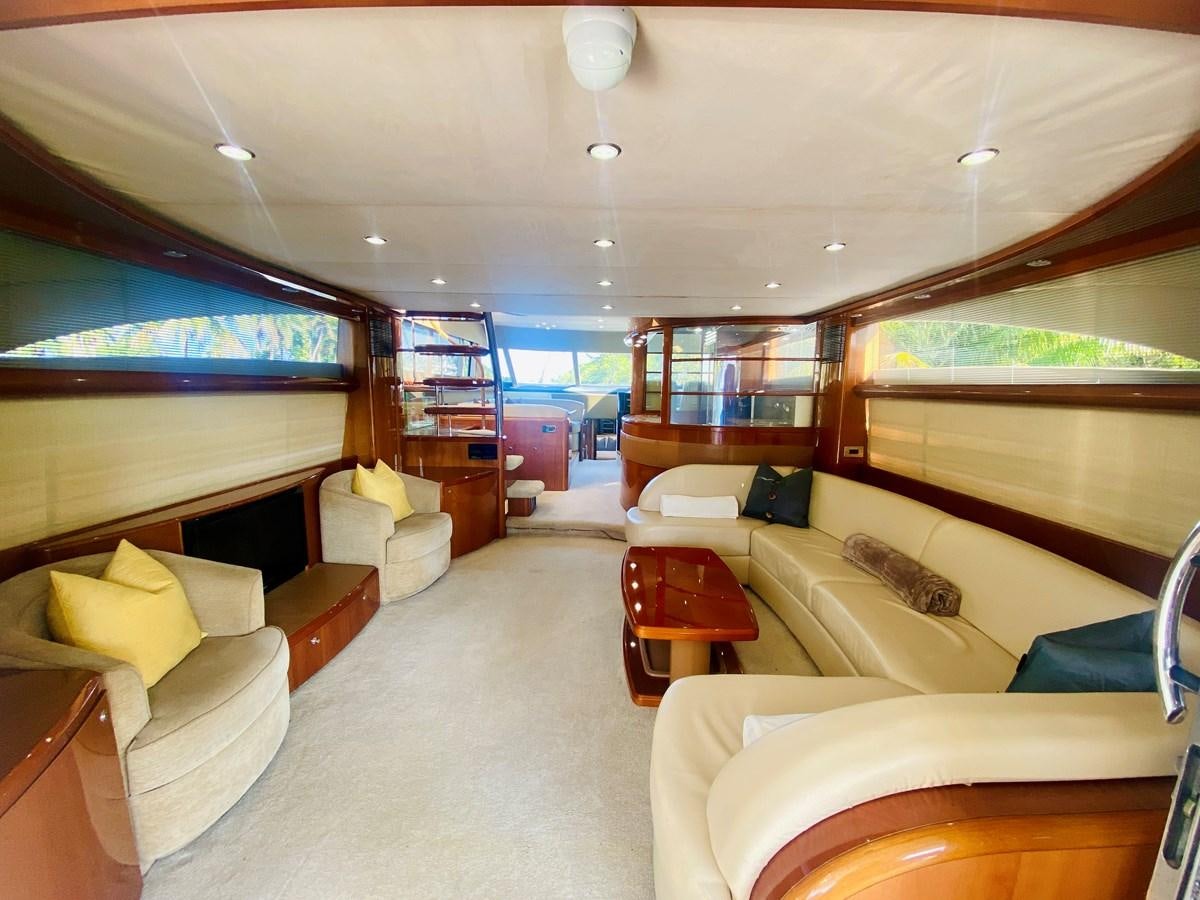a living room with a large window aboard GRAND CRU Yacht for Sale