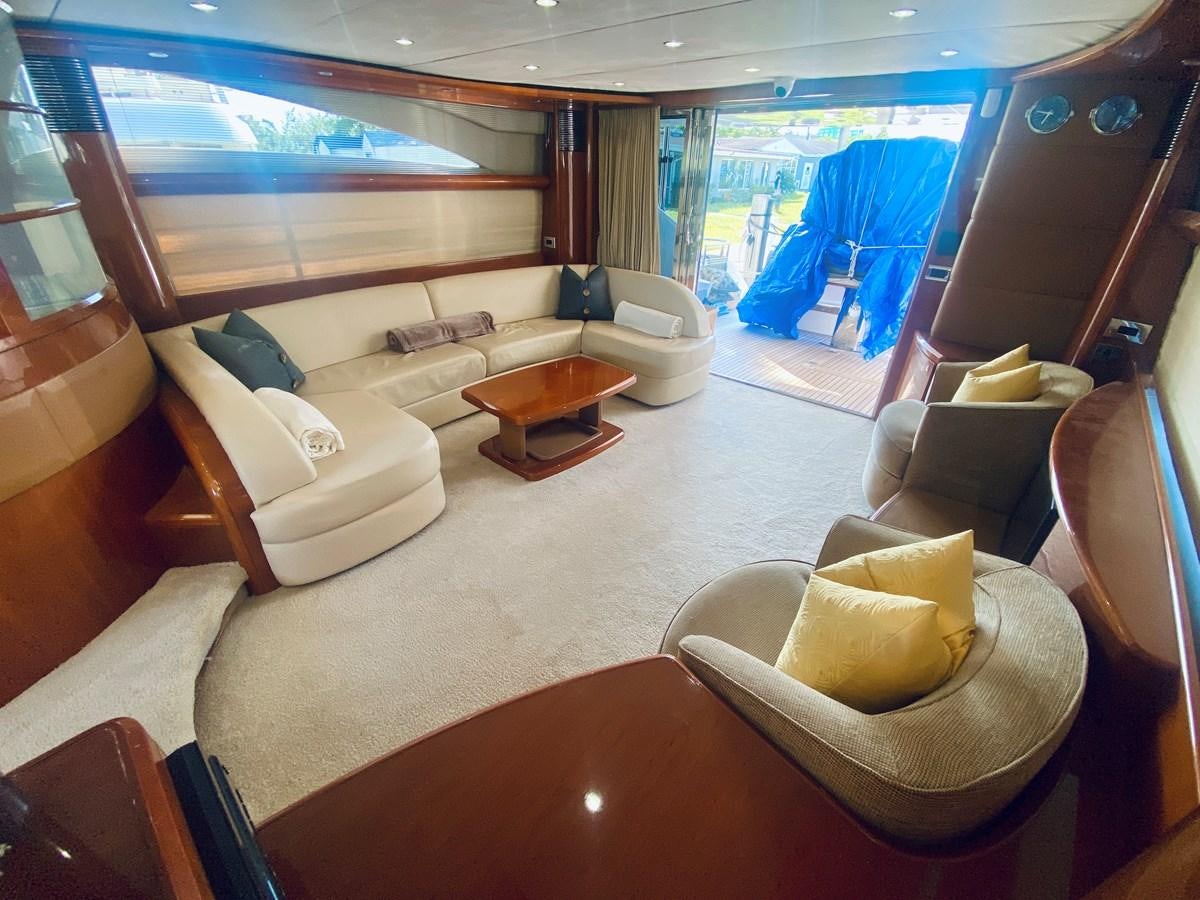 a living room with a large window aboard GRAND CRU Yacht for Sale